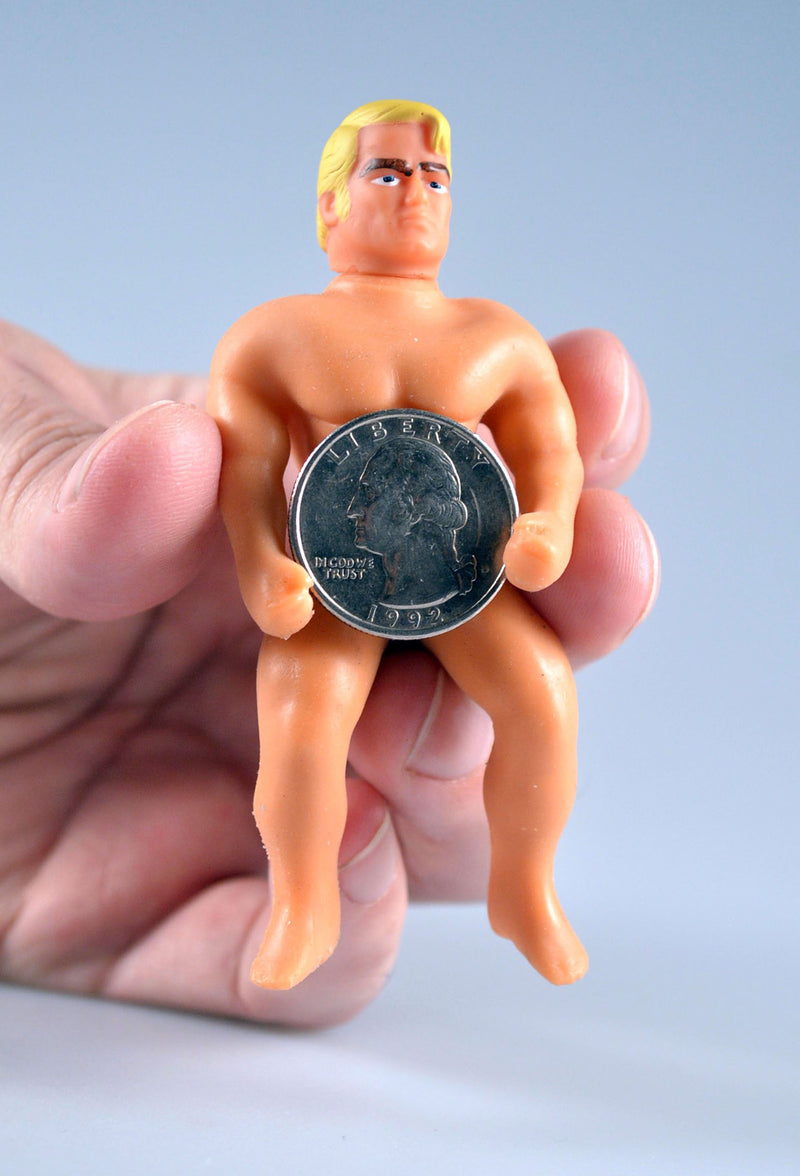 World’s Smallest Stretch Armstrong holding a quarter