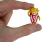 World’s Smallest Fall Guys Micro Figures- French Fries held to scale