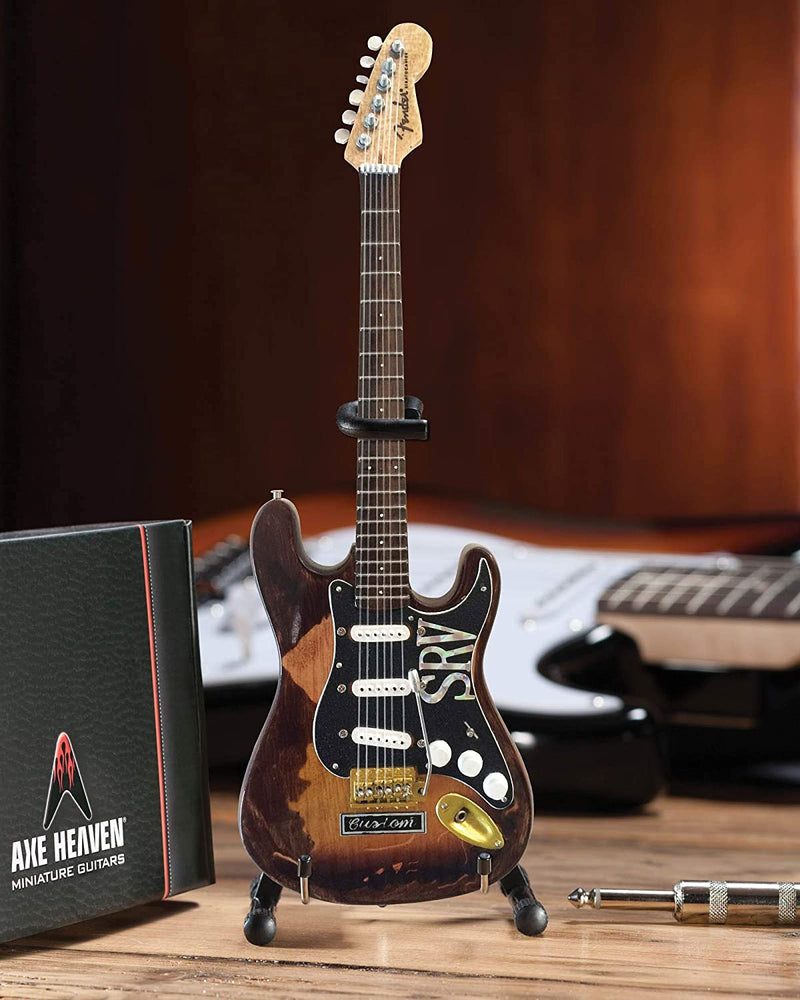 Axe Heaven Stevie Ray Vaughan Fender Stratocaster Mini Guitar Replica - Officially Licensed (SRV-040) on desk
