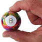 World's Smallest Tie Dye Magic 8 Ball in hand
