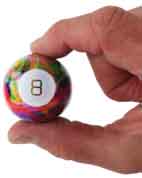 World's Smallest Tie Dye Magic 8 Ball in hand