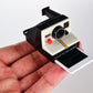 World's Coolest Polaroid Camera in hand