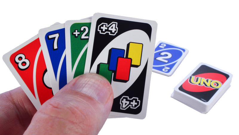 World's Smallest - Uno card game in hand